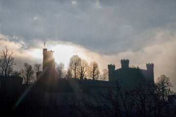 Silhouette of castle against sunset