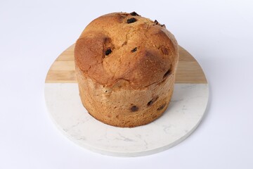 Christmas food. Delicious Panettone cake on white background, closeup