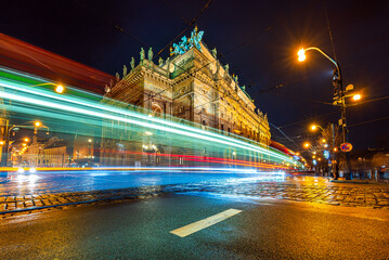 Light trails of tram next to the National Theatre in UNESCO world heritage site city Prague in night. 