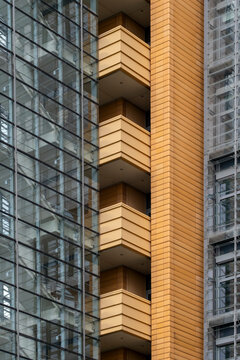 Architecture staircase captured in abstract perspective with minimal design, geometric structure and symmetry, showing modern steps illuminated by diffused urban light.