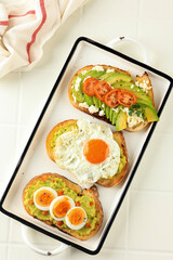 Assortment of vegan sandwiches with avocado and tomatoes