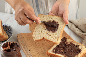 Spreading Tasty CHocolate Nut Butter onto Toast