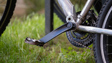 Close-up of bicycle pedal and gear mechanism outdoors