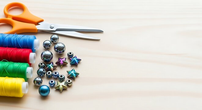 Craft supplies including scissors thread spools and colorful beads on wood
