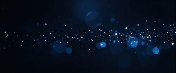 Festive closeup of glowing blue and white bokeh lights creating a magical, shimmering glitter effect on a dark abstract background