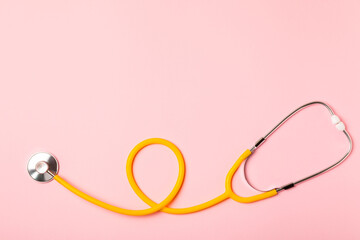 Fototapeta premium Stethoscope on the table. Medical instrument. Medical concept. Healthcare. Health Day.Doctor equipment. Cardiology. Heart disease.Lung diagnostics.Diagnosis of respiratory inflammation.Space for text