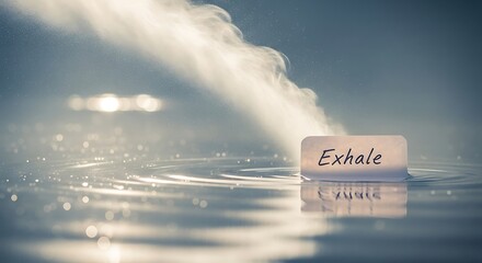 Serene water ripples catch gentle light as a floating card whispers "Exhale", inviting calm and mindful moments of peace and relaxation in a tranquil, ethereal setting.