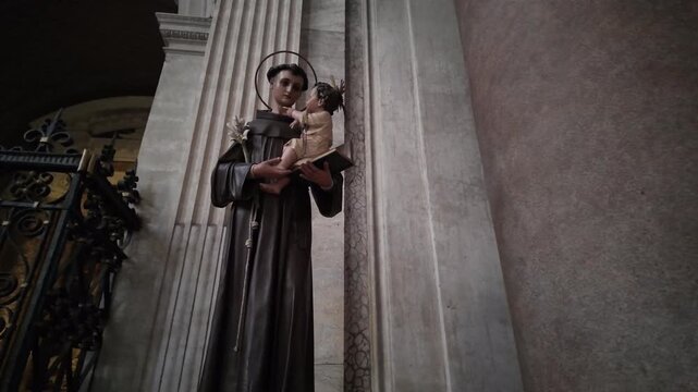 A tender statue of Saint Anthony of Padua holding the infant Jesus