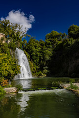 Obraz premium Isola del Liri, Frosinone, Lazio, Italy - The village, with its impressive waterfall in the historic center of the city. The river flows past the Boncompagni-Viscogliosi Castle, forming an island.