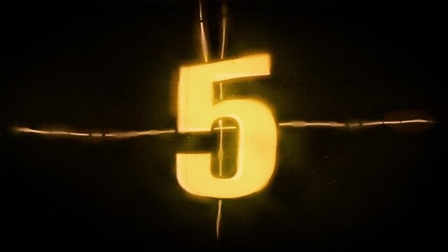 Vintage film countdown with warm glow and risograph style grain. Analog cinema projection aesthetics animation