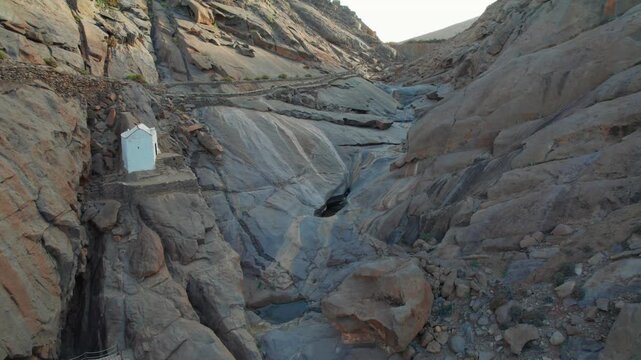 Stunning aerial perspective revealing the rocky landscape and hermitage inside the Penitas ravine