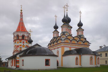 Church of St. Lazarus of Bethany resurrection and Saint Antipas church in the center of Suzdal. Cloudy autumn view