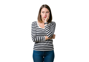 Frustrated young woman in black and white striped shirt, resting chin on hand with a bored and pensive expression, looking to the side, isolated on transparent background.