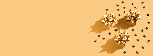 Gift paper ribbon bow with stars, trendy composition, minimal background. Winter, sale and seasonal...