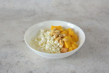 Healthy Breakfast Bowl with Cottage Cheese, Mango and Cashews cut out