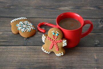 Cozy Christmas Treats Gingerbread Cookies and Hot Chocolate on wooden background