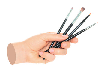 Woman hand holds black cosmetics brush, isolated on transparent background, cosmetics and visage concept. Contemporary art