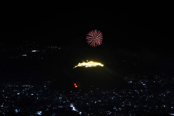 An aerial view shows fireworks lighting up the night sky over Taiz during celebrations marking the anniversary of the Yemeni revolution.