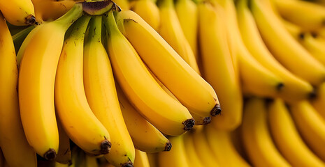 Fresh bananas stacked in a vibrant display, showcasing their rich yellow color and inviting texture for culinary use.