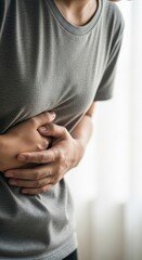 Woman holding her stomach in pain