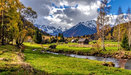Picturesque autumn landscape showcases a vibrant meadow, flowing river, rustic buildings, and snow-capped mountains under a dynamic, cloudy sky