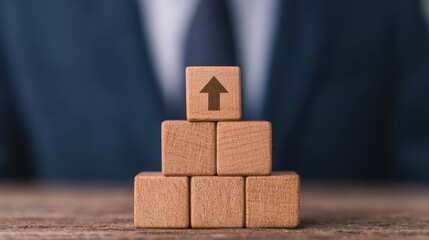 Building success person stacking wooden blocks with upward arrow icons in a business environment