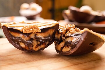 A rich and indulgent chocolate spoon egg layered with creamy filling and drizzled with caramel and chocolate. Topped with crunchy walnuts, it offers a perfect balance of texture and flavor, ideal for 