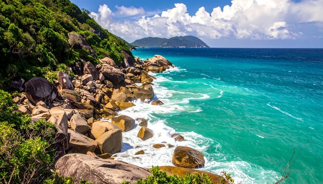 Picturesque coastal scene with lush green vegetation, rocky shores, and crystal-clear turquoise water meeting a vast blue ocean