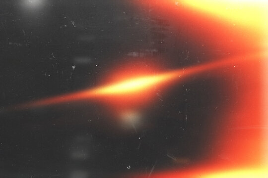 light leak overlay effect with scratch dust and orange light leaks,retro grain noisy film flare on black background,analog old film burn overlay,abstract distressed background with rays and lens
