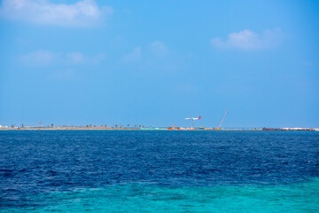 Tranquil closeup calm sea water waves with palm trees. Beautiful Panorama, Tropical island beach landscape exotic shore coast. Summer vacation, holiday amazing nature. Relax paradise, Maldives.