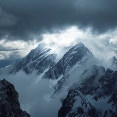 Fototapeta premium The weather is snowy over the huge mountains and the mountains are covered with heavy snow, creating a magnificent view.