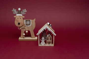 Wooden Christmas reindeer and snow house decorations

