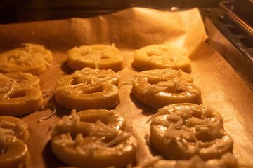 Homemade cheese pastries baking in oven
