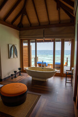 Tranquil closeup calm sea water waves with palm trees. Beautiful Panorama, Tropical island beach landscape exotic shore coast. Summer vacation, holiday amazing nature. Relax paradise, Maldives.