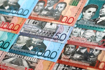 Dominican Republic Pesos currency money bills. DOP currency banknotes in stack with different denomination close up