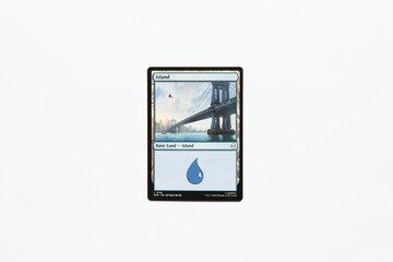Obraz premium Bradford, UK Nov 3 2025 Basic Land Island Spider-man card magic the gathering card shot isolated on a white paper background.
