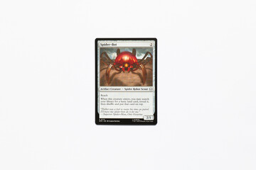 Obraz premium Bradford, UK Nov 3 2025 Spider-Bot Artifact Creature card from the Spider-man magic the gathering card game shot isolated on a white paper background.