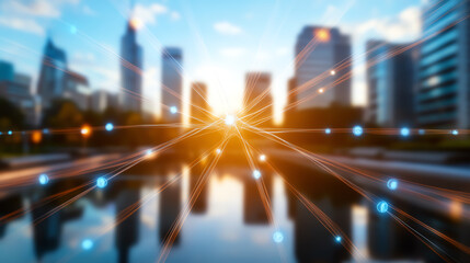 Obraz premium Blurred skyline with bright sunlight reflecting on water, creating a serene urban atmosphere at dusk.