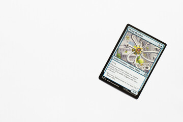 Obraz premium Bradford, UK Nov 3 2025 Flying Octobot card from the Spider-man magic the gathering card game shot isolated on a white paper background.