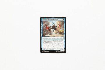 Naklejka premium Bradford, UK Nov 3 2025 Doc Ock, Sinister Scientist card from Spider-man magic the gathering card shot isolated on a white paper background.