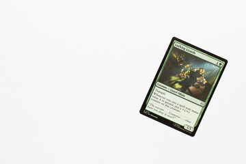 Naklejka premium Bradford, UK Nov 3 2025 Lurking Lizards card from Spider-man magic the gathering card game shot isolated on a white paper background.