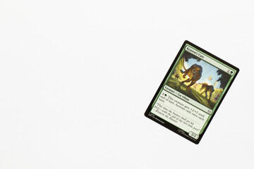 Naklejka premium Bradford, UK Nov 3 2025 Kraven's Cats card from Spider-man magic the gathering card game shot isolated on a white paper background.