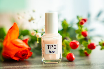 TPO free gel nail polish lying on a table in soft natural light. Highlighting clean beauty choices and awareness of Trimethylbenzoyl Diphenylphosphine Oxide in cosmetics