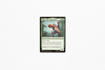 Naklejka premium Bradford, UK Nov 3 2025 Spider-Rex, Daring Dino card from Spider-man magic the gathering shot isolated on a white paper background.