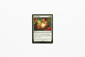 Naklejka premium Bradford, UK Nov 3 2025 Venom Blast card from Spider-man magic the gathering shot isolated on a white paper background.