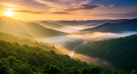 Sunrise over misty mountain valley