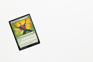 Naklejka premium Bradford, UK Nov 3 2025 Grow Extra Arms card from Spider-man magic the gathering shot isolated on a white paper background.
