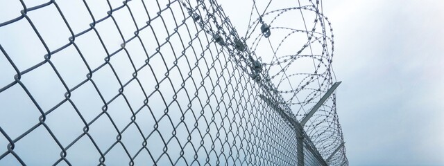 Barbed wire fence at state border, air port or prison