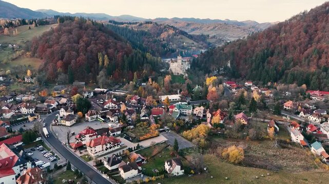 Aerial footage of Bran castle on a sunny autumn day.