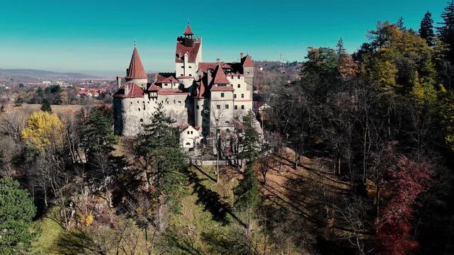 Aerial footage of Bran castle on a sunny autumn day.